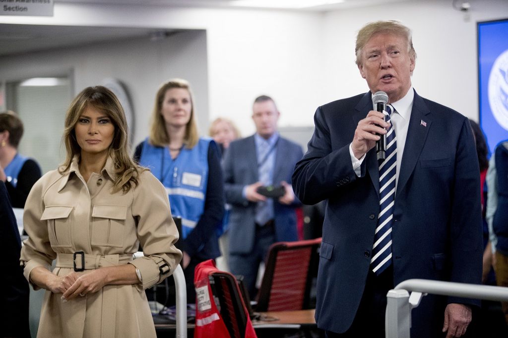 US President Donald Trump right accompanied by first lady Melania Trump left speaks to employees at the Federal Emergency Management Agency Headquarters Wednesday