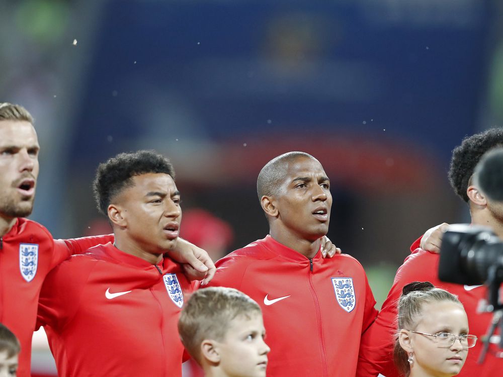 Flies surround the English team during the anthem prior the group G match between Tunisia and England at the 2018 soccer World Cup in the Volgograd Arena in Volgograd Russia Monday