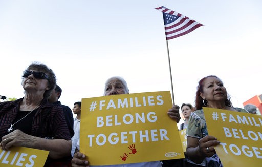 People take part in a Rally For Our Children event to protest a new'zero-tolerance immigration policy that has led to the separation of families Thursday