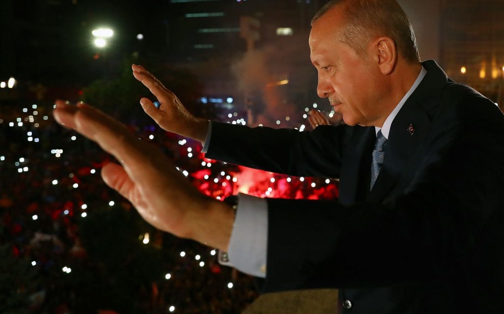 President of Turkey and leader of the Justice and Development Party Recep Tayyip Erdogan greets the crowd at a late night victory speech