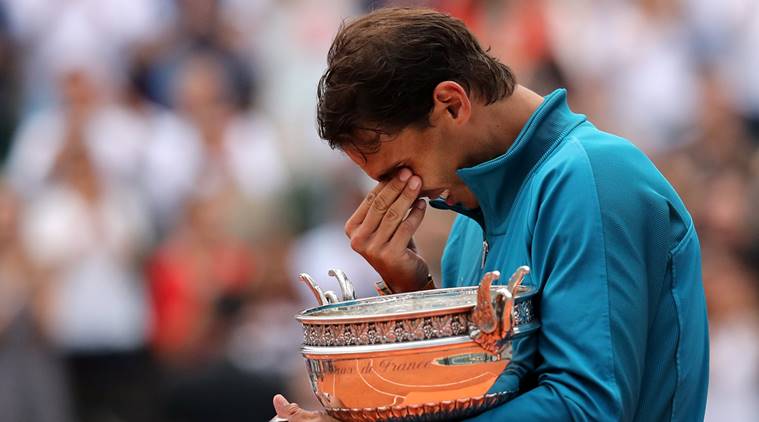 Spain's Rafael Nadal celebrates with the trophy after winning the French Open final against Austria's Dominic Thiem