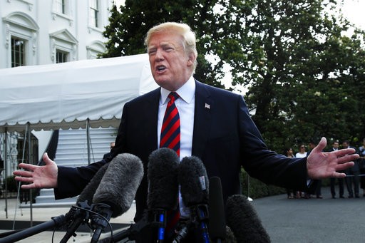 President Donald Trump speaks to reporters before leaving the White House in Washington Friday