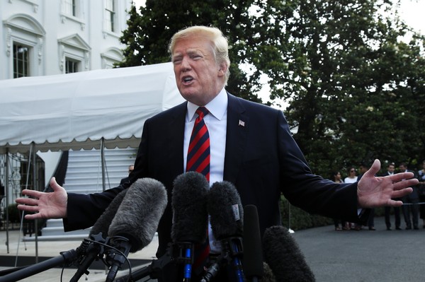 President Donald Trump speaks to reporters before leaving the White House in Washington Friday