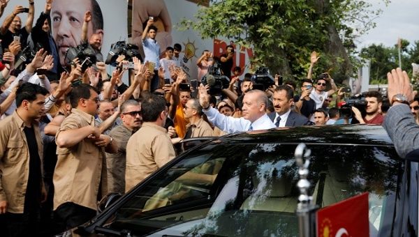 Turkish President Tayyip Erdogan waves to supporters as he leaves his residence in Istanbul Turkey