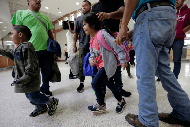 A group of immigrants from Honduras and Guatemala seeking asylum arrive at the bus station after they were processed and released by U.S. Customs and Border Protection Thursday