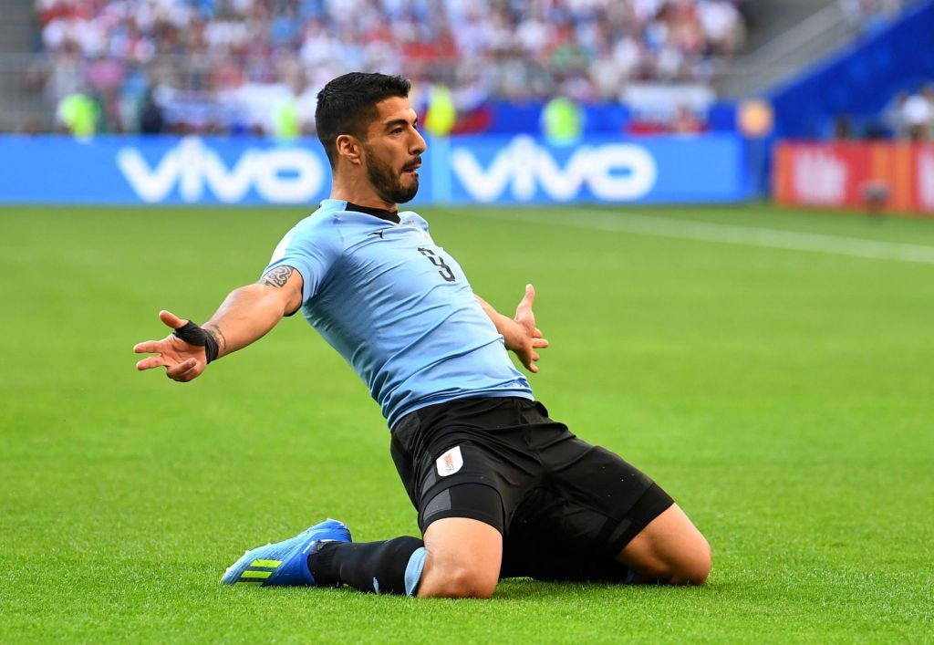 Uruguay's Luis Suarez celebrates scoring their first goal against Russia. REUTERS  Dylan Martinez