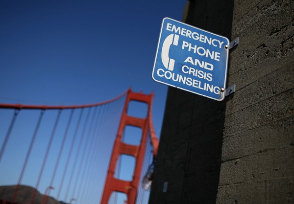 A sign for an emergency phone is seen on the span of the Golden Gate Bridge in San Francisco California. Prevention suicide is a priority in Oregon given the high rate of deaths by suicide