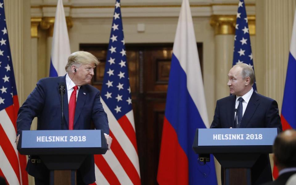 U.S. President Donald Trump left and Russian President Vladimir Putin arrive for a press conference after the meeting of U.S. President Donald Trump and Russian President Vladimir Putin at the Presidential Palace in Helsinki Finland Monday