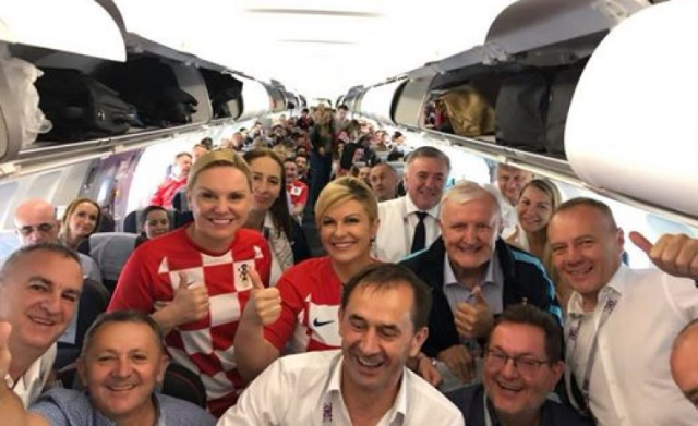 Croatian president flies economy class to Russia to cheer World Cup team