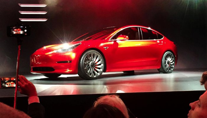 Tesla 'real car company' after hitting Model 3 goal, Musk says