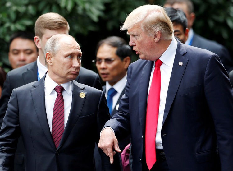 Trump and Russia's President Vladimir Putin talk during the family