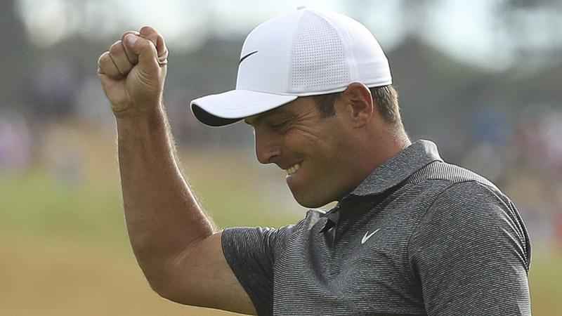 Francesco Molinari of Italy celebrates after putting a birdie on the 18th green after the final round for the 147th British Open Golf championships