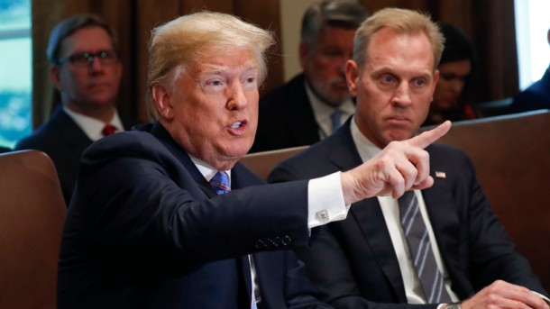 President Donald Trump gestures while speaking during his meeting with members of his cabinet in Cabinet Room of the White House in Washington Wednesday