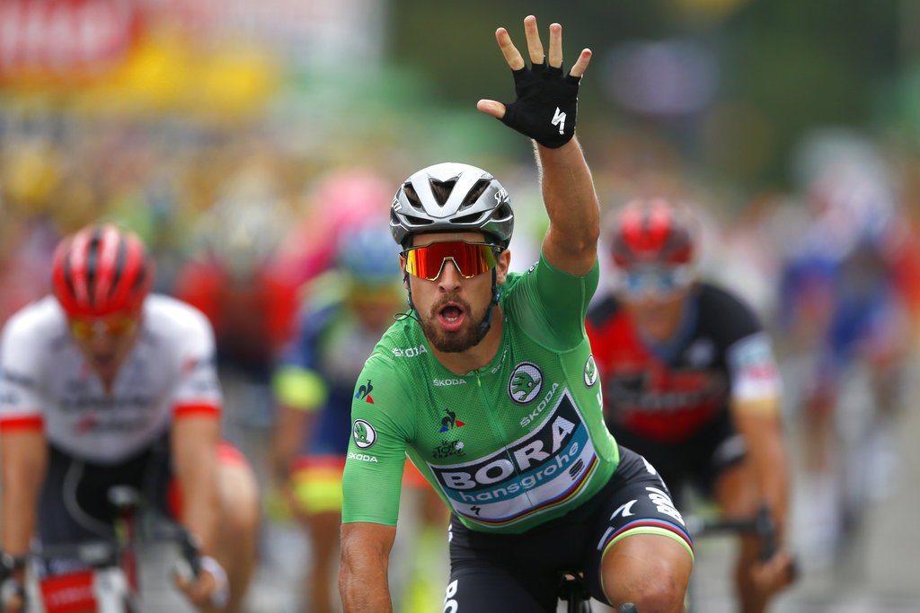 Slovakia's Peter Sagan wearing the best sprinter's green jersey celebrates as he crosses the finish line to win the thirteenth stage of the Tour de France cycling race over 169.5 kilometers with start in Bourg d'Oisans and