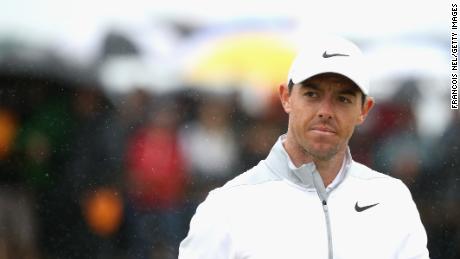 Rory Mc Ilroy climbed into contention despite rain and cold in Carnoustie Friday