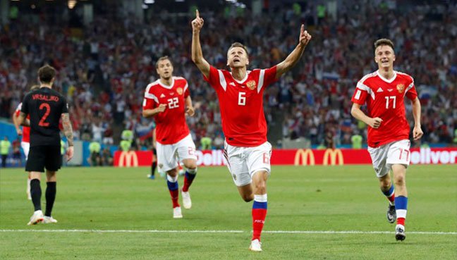 Russia’s Denis Cheryshev celebrates scoring their first goal