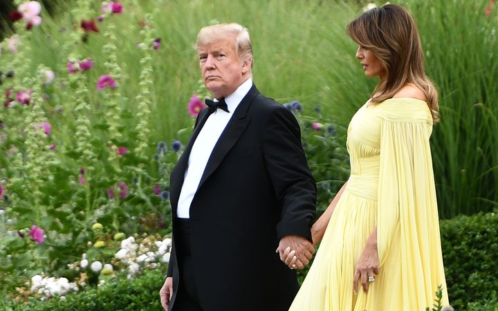 US President Donald Trump and First Lady Melania Trump leave the US ambassador's residence in London heading to Blenheim Palace for a dinner on the first day of a UK visit