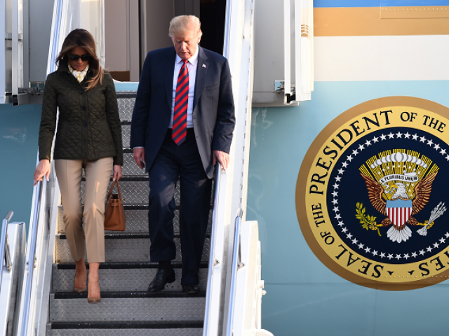 US President Donald Trump disembarks Air Force One with US First Lady Melania Trump at Prestwick Airport south of Glasgow