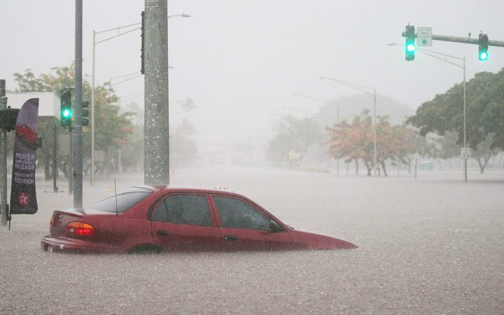 A car is submerged in floodwaters on Hawaii's Big Island as Hurricane Lane approaches