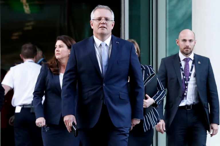 Australia's Scott Morrison arrives for a party meeting in Canberra