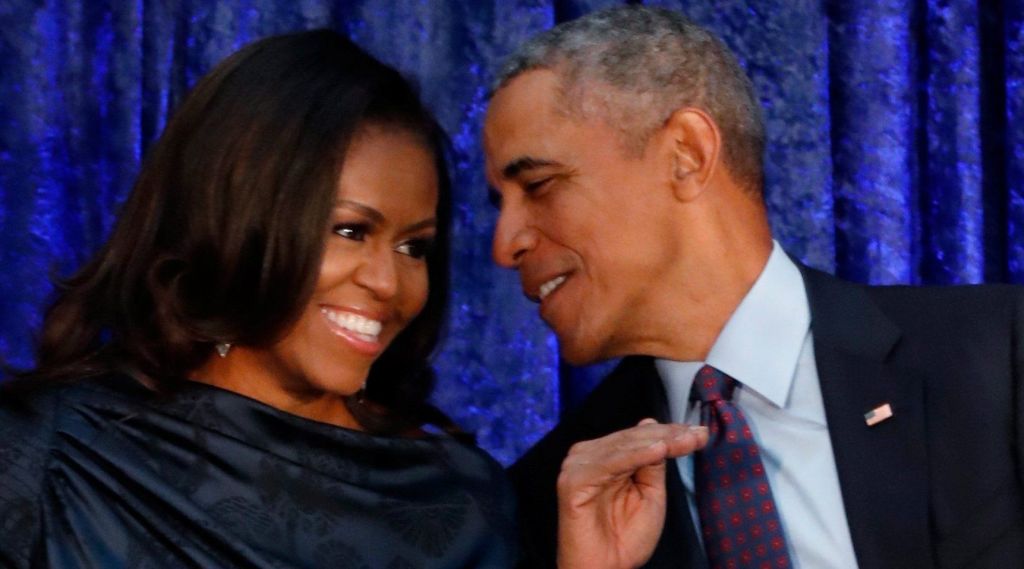 Barack Obama sits with former first lady Michelle Obama prior to the the unveiling of their portraits at the Smithsonian???s National Portrait in Washington DC U.S