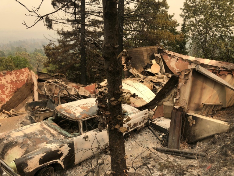 The remains of an antique car collection lie in a fire devastated neighborhood near Redding California as firefighters from across the country battle a blaze known as the Carr fire