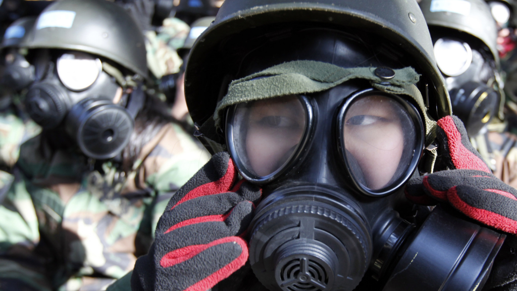 South Korean teenagers near Seoul wear gas masks for a military drill to prepare for radiological attacks. Credit Lee Jae-won  Reuters