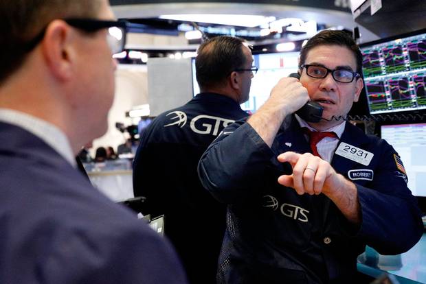 Traders work on the floor of the New York Stock Exchange