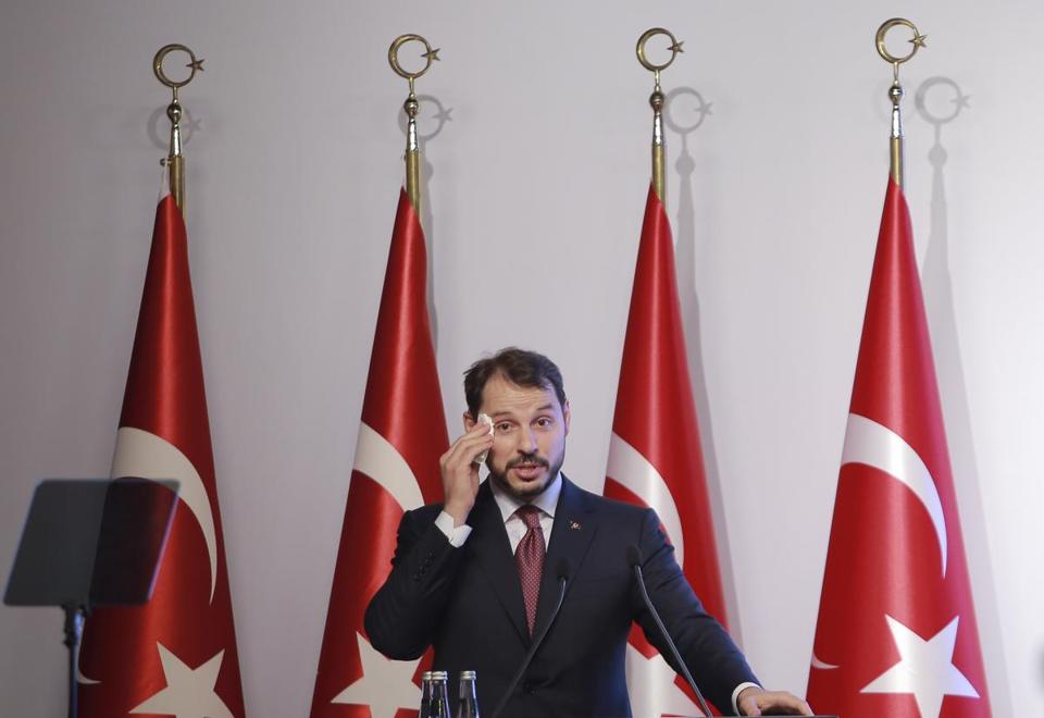 Berat Albayrak Turkey's Treasury and Finance Minister wiped his forehead as he spoke during a news conference in Istanbul Friday