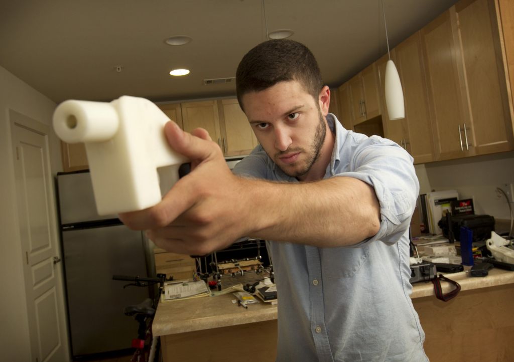 Cody Wilson shows the first completely 3D-printed handgun The Liberator at his home in Austin Texas on Friday