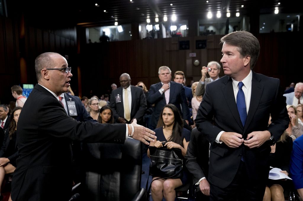 Fred Guttenberg the father of Jamie Guttenberg who was killed in the Stoneman Douglas High School shooting in Parkland Florida. left attempts to shake hands with Supreme Court nominee Brett Kavanaugh on Capitol Hill in Washington