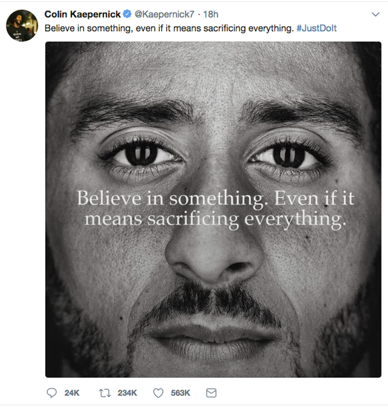 Former National Football League player Colin Kaepernick shows a Nike advertisement featuring him that was posted Monday Sept. 3