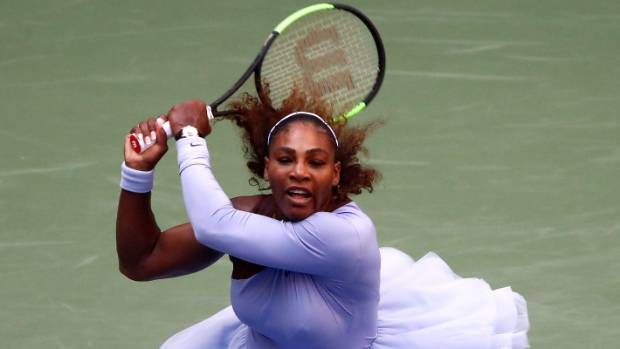 Serena Williams hits a return during her 6-0 4-6 6-3 win over Estonia's Kaia Kanepi at Flushing Meadows