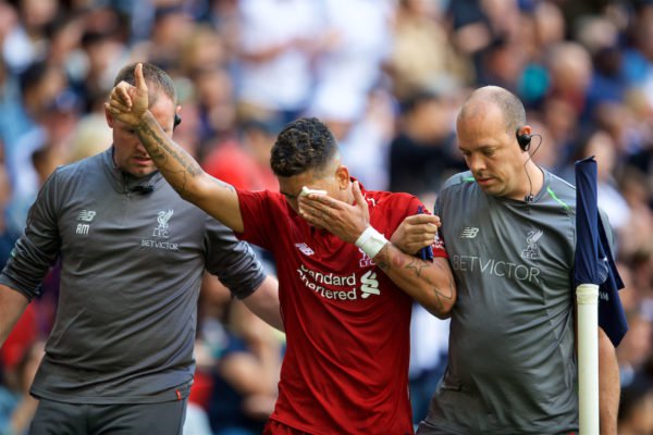 Liverpool's Roberto Firmino goes off injured after being struck in the face during the FA Premier League match between Tottenham Hotspur FC and Liverpool FC at Wembley Stadium. (Pic by David Rawcliffe  P