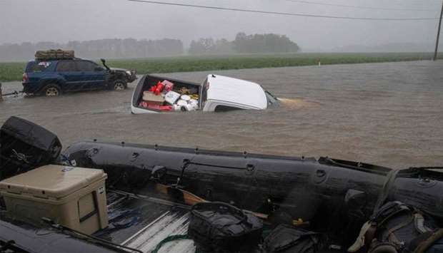 A pickup truck is seen submerged in floodwater in Lumberton North Carolina