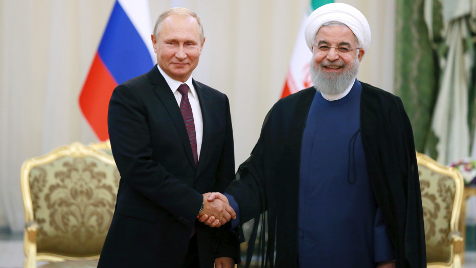 Iran's President Hassan Rouhani right shakes hands with Russia's President Vladimir Putin in Tehran Iran Friday after their talks part of Russia-Iran-Turkey summit to discuss Syria Friday Sept. 7 2018. Putin Erdogan and Iran's Pre