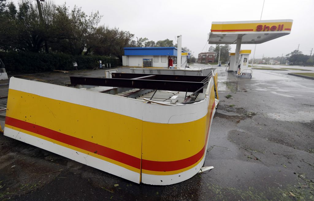 The shelter of a petrol station lies on the ground in Wilmington