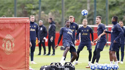 Manchester United's Paul Pogba center attends a training session at the AON Training Complex Carrington north west England Monday Oct. 1 2018