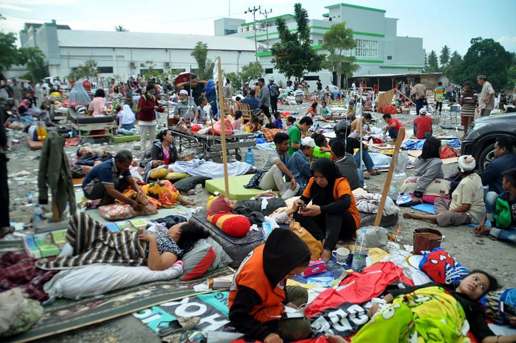 Medical team help wounded residents outside a hospital in on Saturday