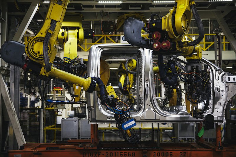 Robotic arms attach rivets to the frame of a truck at the Ford Motor Company Dearborn Truck Plant in Dearborn Michigan