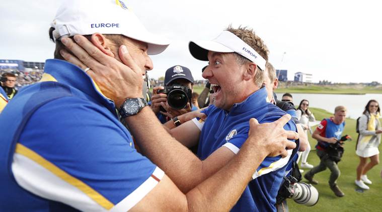 Team Europe’s Sergio Garcia celebrates with Ian Poulter after winning the Ryder Cup