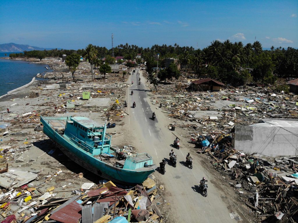 The tsunami left a trail of destruction in Palu tossing ships on to land and flattening buildings