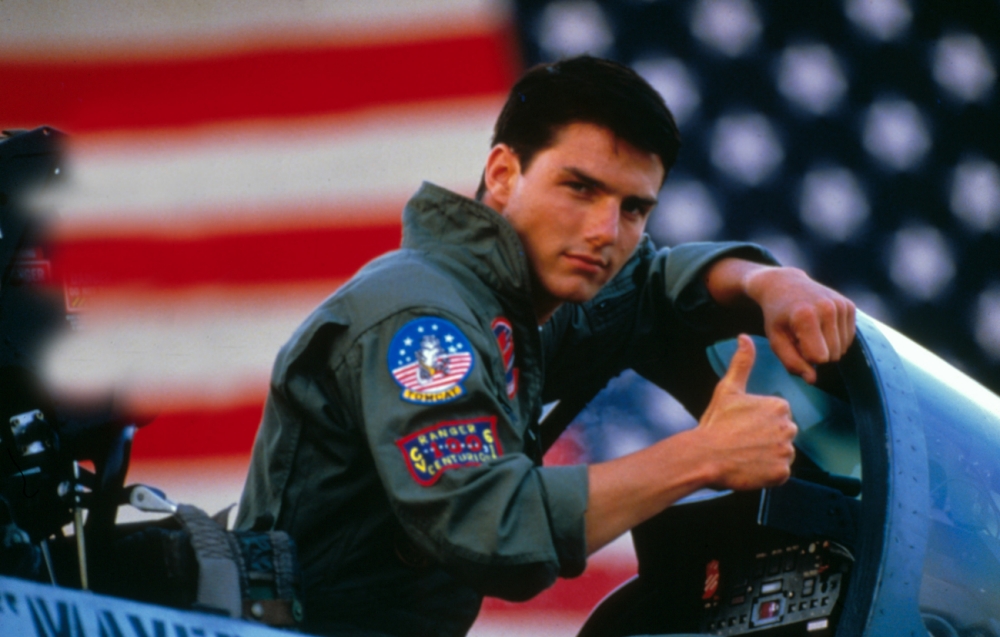 Tom Cruise giving the thumbs up to another