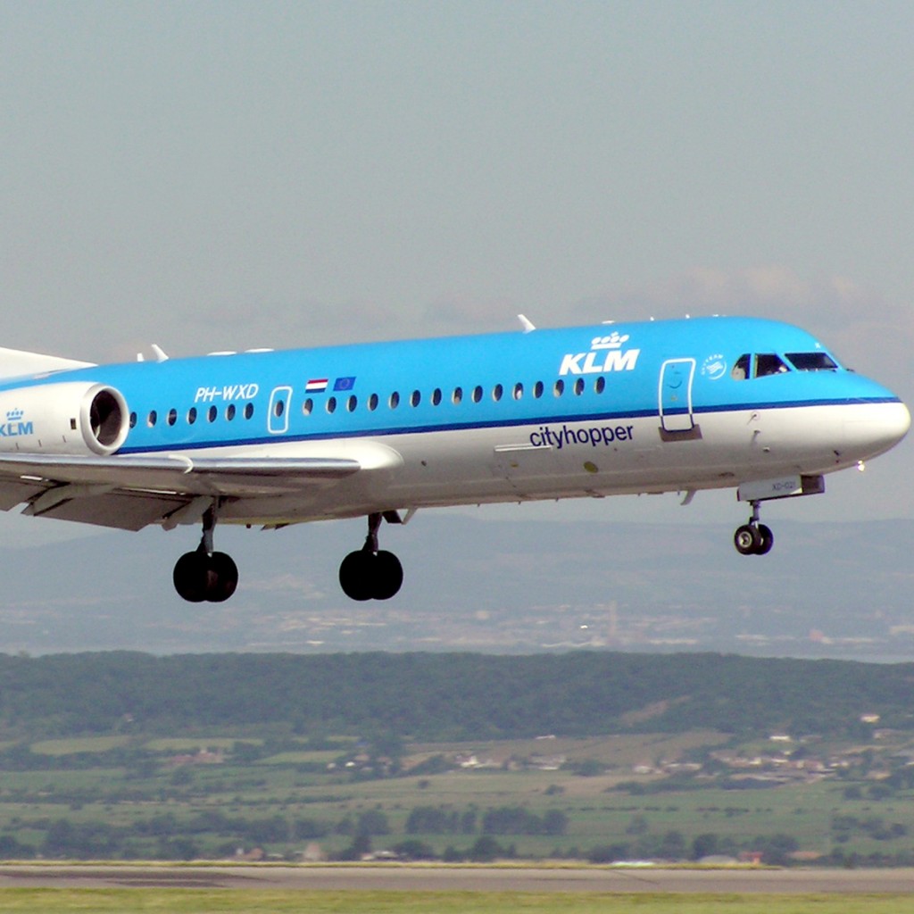 A Fokker 70 owned by KLM flies over Bristol England Aug. 2005