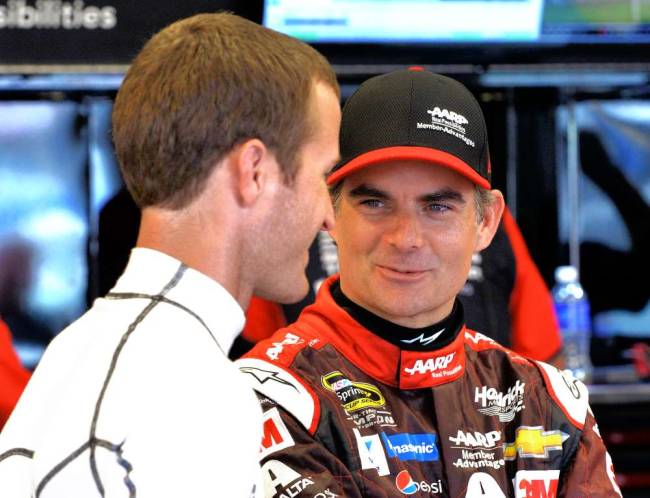 Jeff Gordon right talking with Kasey Kahne on Friday while waiting out the rain during practice at Kentucky Speedway