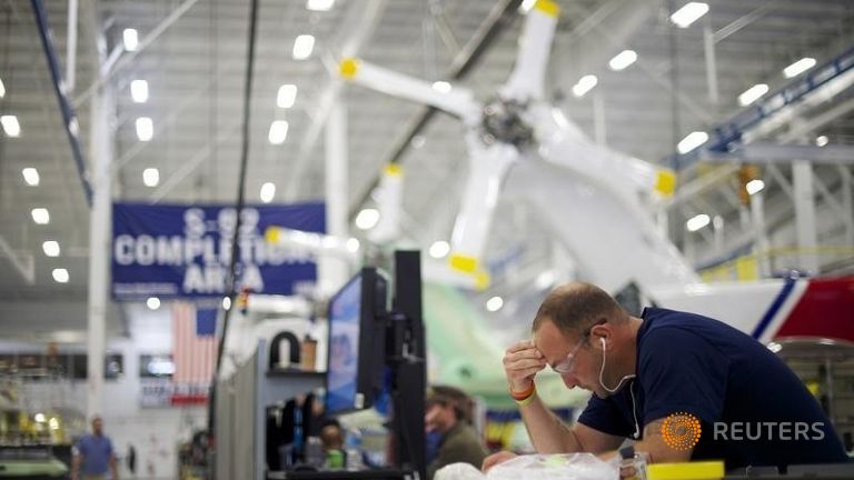 Aircraft technicians assemble S-92A helicopters at Sikorsky Global Helicopters in Coatesville Pennsylvania