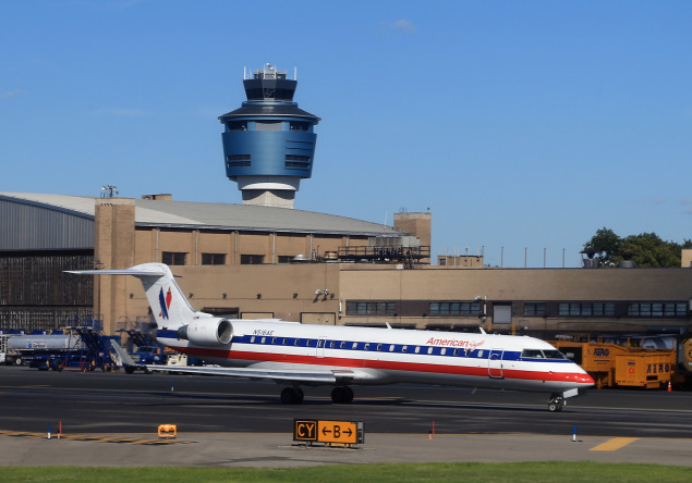 An American Airlines jet taxis on the runway of LaGuardia