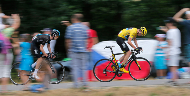 Britain's Chris Froome wearing the overall leader's yellow jersey is followed by teammate Wout Poels of the Netherlands