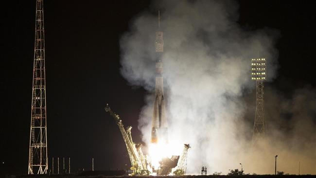 The Soyuz TMA-17M spacecraft with its international crew blasts off a launch pad of a Russian Baikonur cosmodrome in Kazakhstan