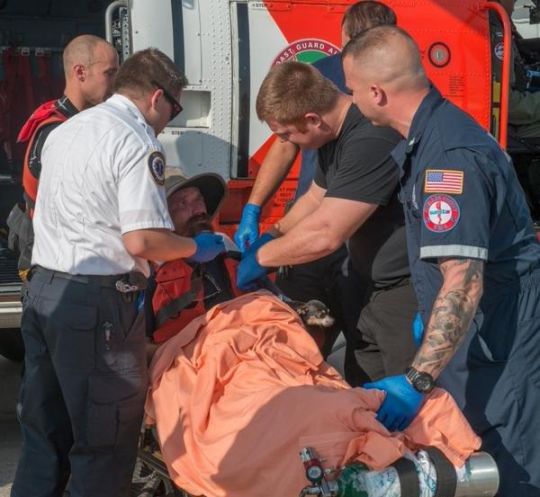 The Coast Guard rescued a man and his dog from a dinghy floating more than 60 miles off the Pasco County coast authorities reported Friday